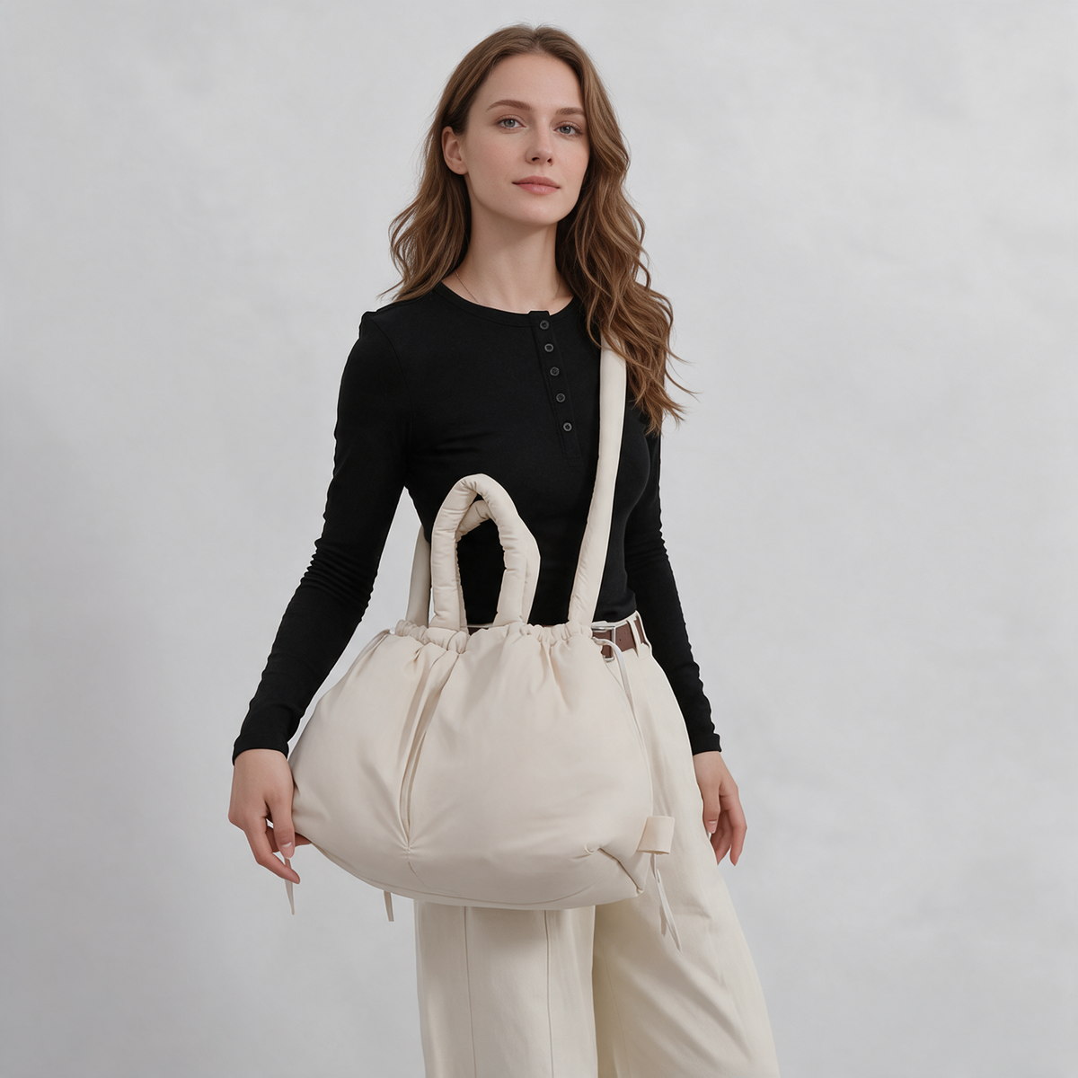 Olise Cloud Bag in ecru worn crossbody