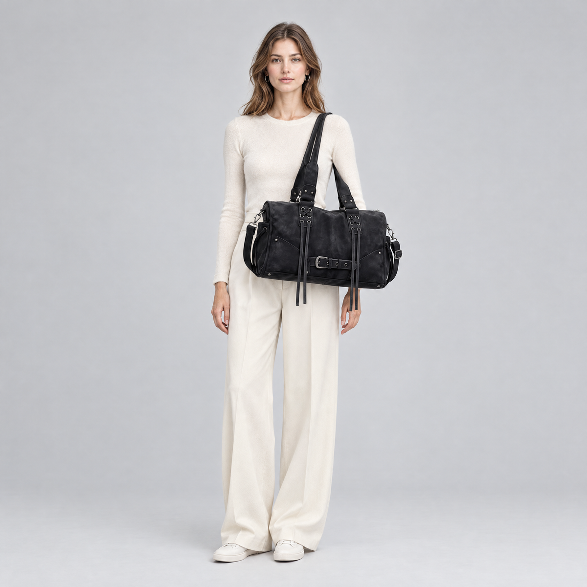 Marlowe retro shoulder bag in black worn on the shoulder
