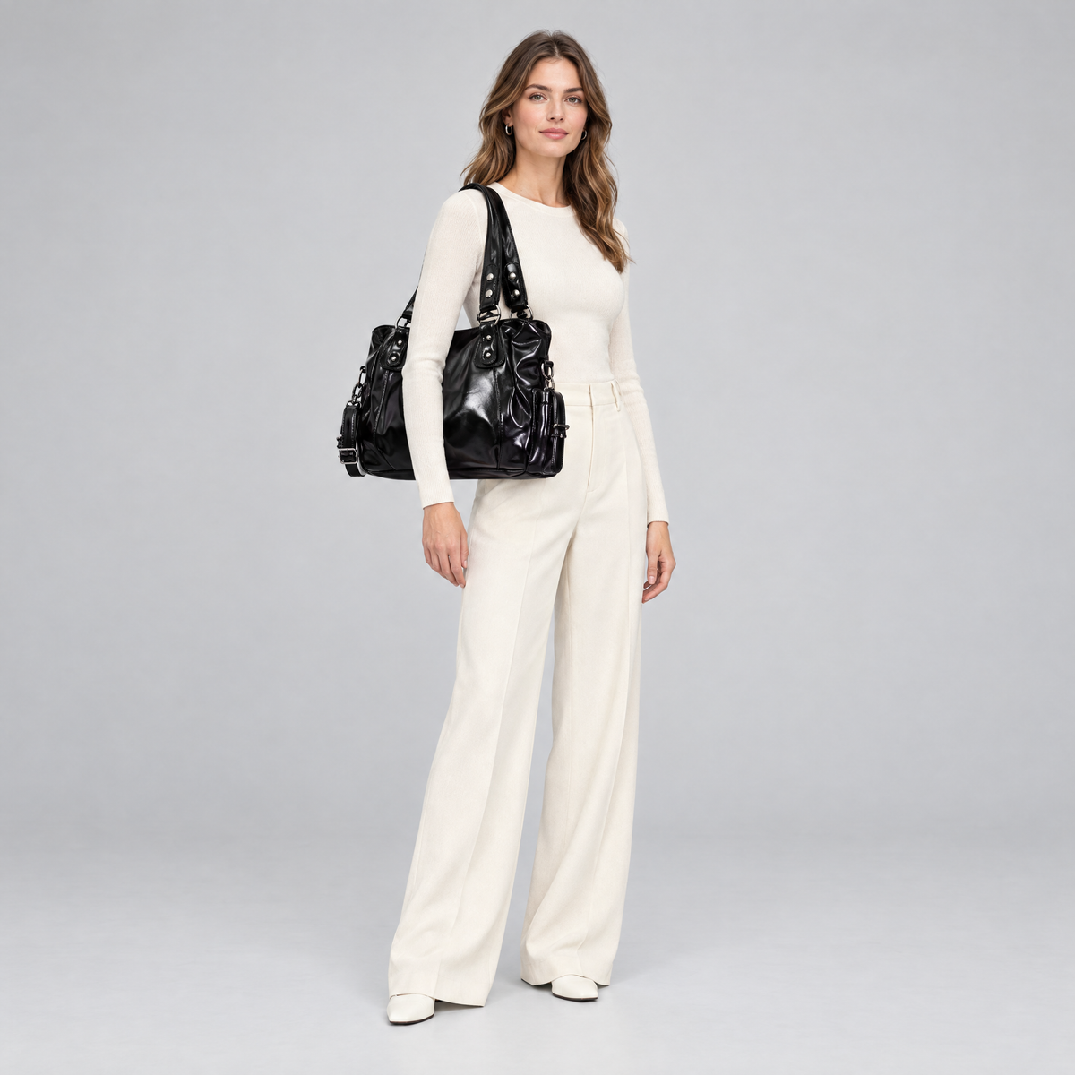 Marlowe vegan leather hobo bag in black worn on the shoulder